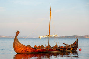 A Viking long boat moored at a buoy-