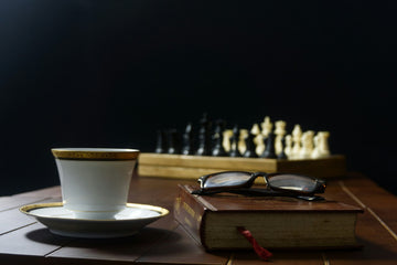 Chess Set and Book - Arya Tulsyan - - Unsplash