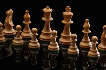 Close up of white chess pieces- randy-fath-unsplash
