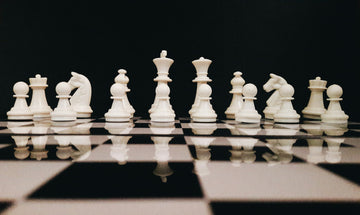 White chess pieces in position ready to start- sk-Unsplash