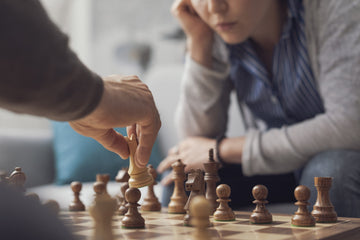 People playing chess together at home