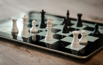 Chess pieces on an iPad.