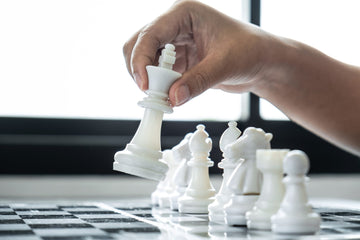 Woman playing chess and thinking strategy plan about crash overt