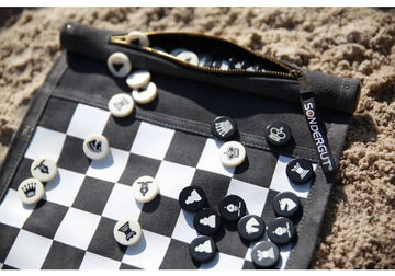 A zip up travel chess and checkers set
